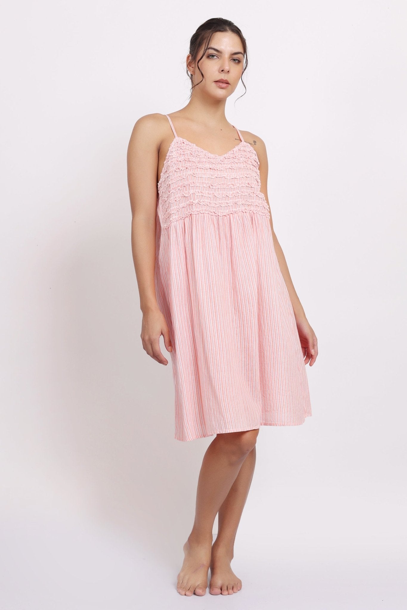 Model wearing Passionflower Frilly Nightie in coral stripe, featuring a square neckline, frill trim, and breezy cotton fit.