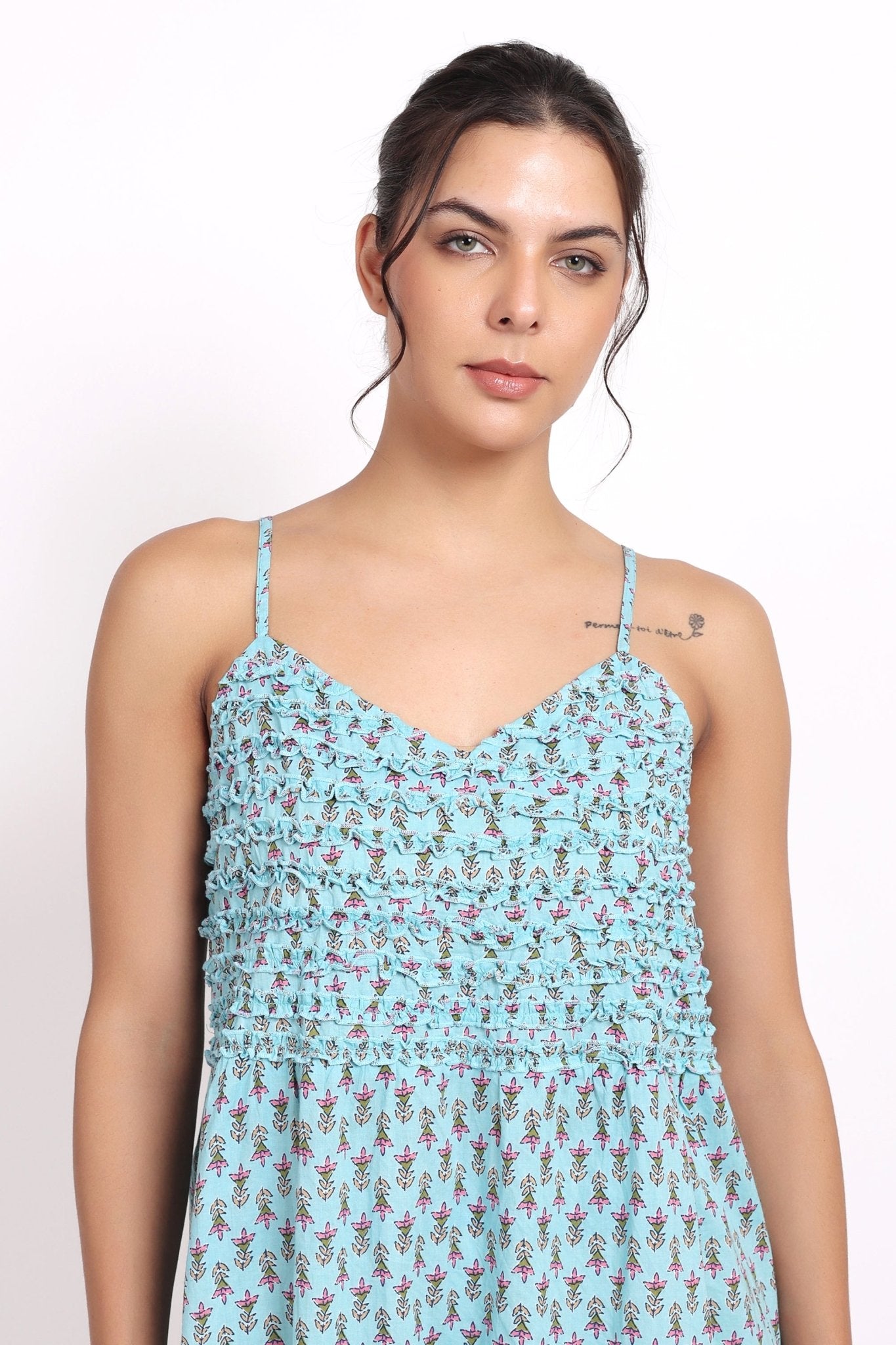 Close-up of neckline detail and floral print on the Bloom Frilly Nightie in aqua cotton voile.