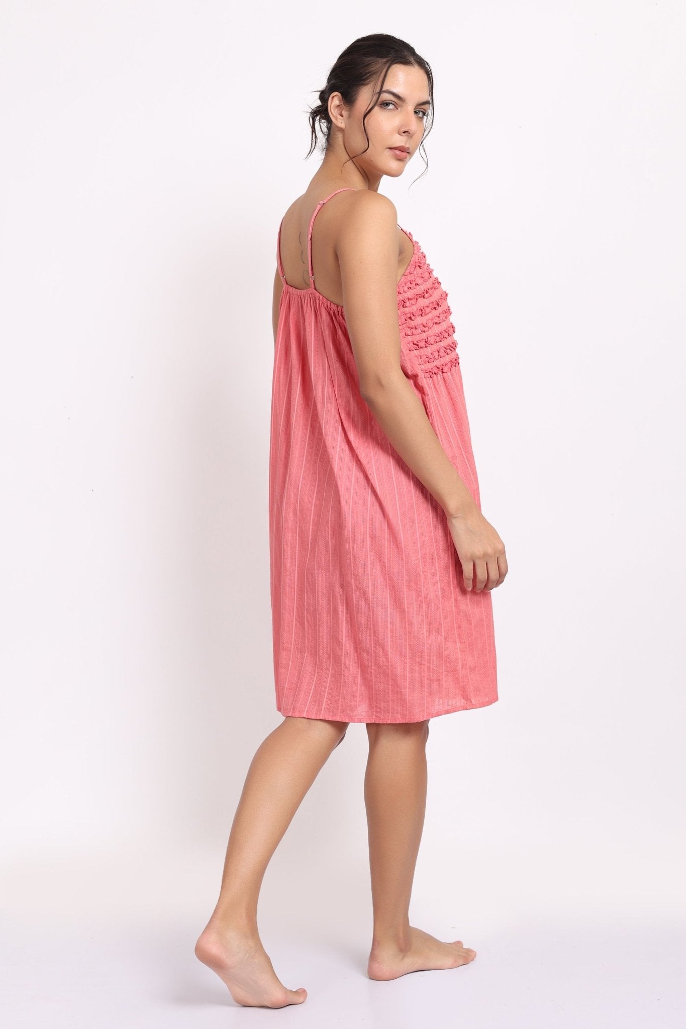 Back view of spaghetti strap nightie in coral cotton voile with self-stripe detail.