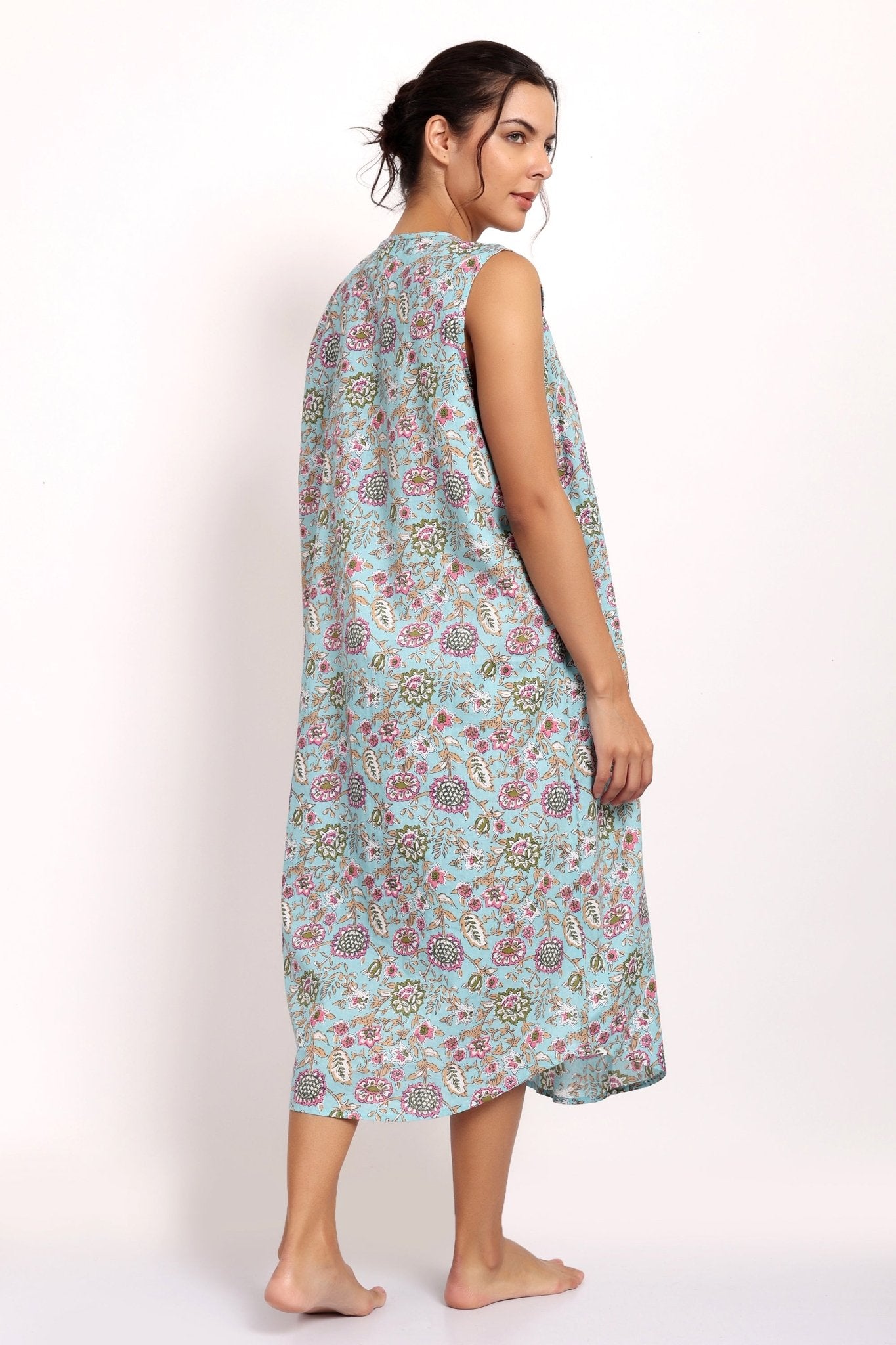 Back view of Bloom Nightie in aqua floral print, featuring airy silhouette and scooped hem.