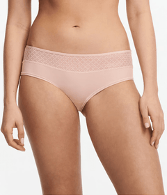Front view of Chantelle Norah Chic Covering Shorty Brief Dusky Pink on model featuring soft eco-friendly fabric and graphic lace.