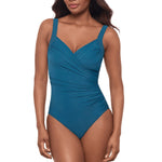 Woman in aegean blue cross over swimsuit