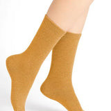 Bleuforêt Wool Cashmere Socks in Jaune Doré Golden Yellow worn mid-calf, featuring soft breathable knit for warmth and style, from The Foundation.