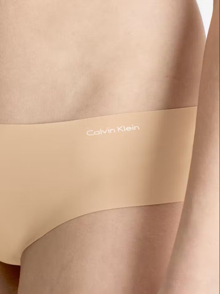 Side view of Calvin Klein Invisibles Hipster Light Caramel, showing soft microfibre fabric and medium rise waist.