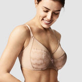 Model showcasing the Chantelle Revele Moi 4 Parts Wire Bra in Nubuck, featuring sheer mesh panels, vertical seams, and full coverage for everyday support. side view