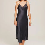 Model wearing Ginia Silk Lace Slip in India Ink, showcasing deep V-neckline and delicate lace trim.
