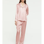 Model wearing Ginia Fine Finishes Silk Pyjama in Bridal Rose, showing collared top and drawstring pants.