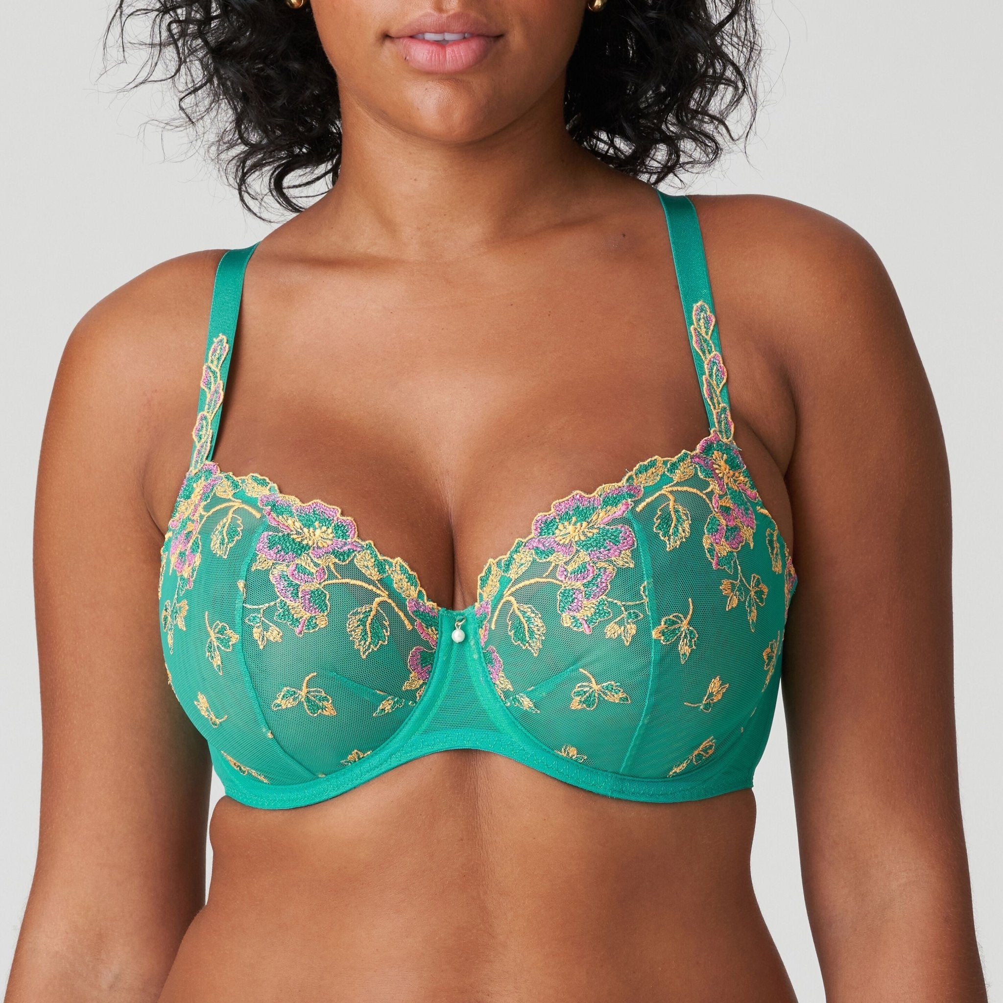 Front view of Lenca Balcony Bra Sunny Teal from The Foundation, showing floral embroidery and bold tropical green with ochre and fuchsia highlights
