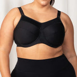 Front view of Triumph Triaction Ultra W Sports Bra in Black, showing full coverage and supportive fit