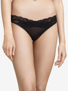 Model wearing Passionata Brooklyn Tanga Brief in Black from The Foundation, designed with sheer mesh, flat lace, and a seamless low-rise fit. front view