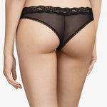 Model wearing Passionata Brooklyn Tanga Brief in Black from The Foundation, designed with sheer mesh, flat lace, and a seamless low-rise fit. back view