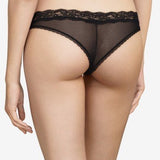 Model wearing Passionata Brooklyn Tanga Brief in Black from The Foundation, designed with sheer mesh, flat lace, and a seamless low-rise fit. back view