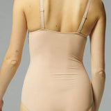 Back view of the Caresse 3D Control Bodysuit Peau Rose by Simone Perele, sold by The Foundation – smooth finish ideal under dresses and fitted outfits.