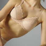 Model wearing Simone Pérèle Caresse Full Cup Bra in Peau Rose from The Foundation, featuring lace overlay, cotton lining, and supportive shaping. close up