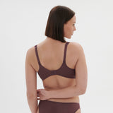 Side profile of model in Dahlia Full Cup Control Bra Byzantine, showing supportive fit and comfort from The Foundation.