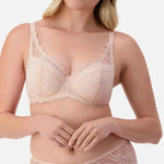 Front view of Triumph Essential Lace Balconette Bra WHP Nude Pink on model showing supportive lace cups and elegant straps.