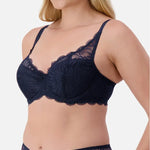Side angle of Triumph Essential Lace Balconette Bra WHP Navy Blue on model showing lightly padded cups and elegant lace detail.