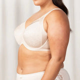 Side view of Triumph Endless Comfort Bra in soft Fresh Powder shade with multi-piece cup and underwire—shop now at The Foundation.