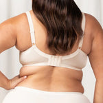 Back view of the Endless Comfort Bra by Triumph, showing smoothing support panels and adjustable straps—available at The Foundation.