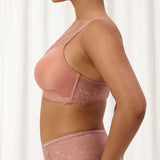 Side angle of The Foundation’s Amourette Charm Wire-Free Bra in Rust, styled with matching brief for a feminine look.
