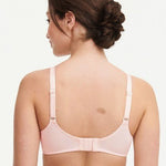 Model in Chantelle C Magnifique Moulded Bra in Rose from The Foundation, showcasing full-coverage cups and supportive smoothing mesh back. back view