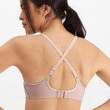 Back view of Electrify Mesh Underwire Sports Bra Soft Powder, displaying supportive cross-back straps from The Foundation.