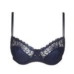 Jane Half Padded Balcony Bra Velvet Blue from The Foundation displayed flat, showcasing intricate lace and signature balcony shape