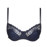 Jane Half Padded Balcony Bra Velvet Blue from The Foundation displayed flat, showcasing intricate lace and signature balcony shape