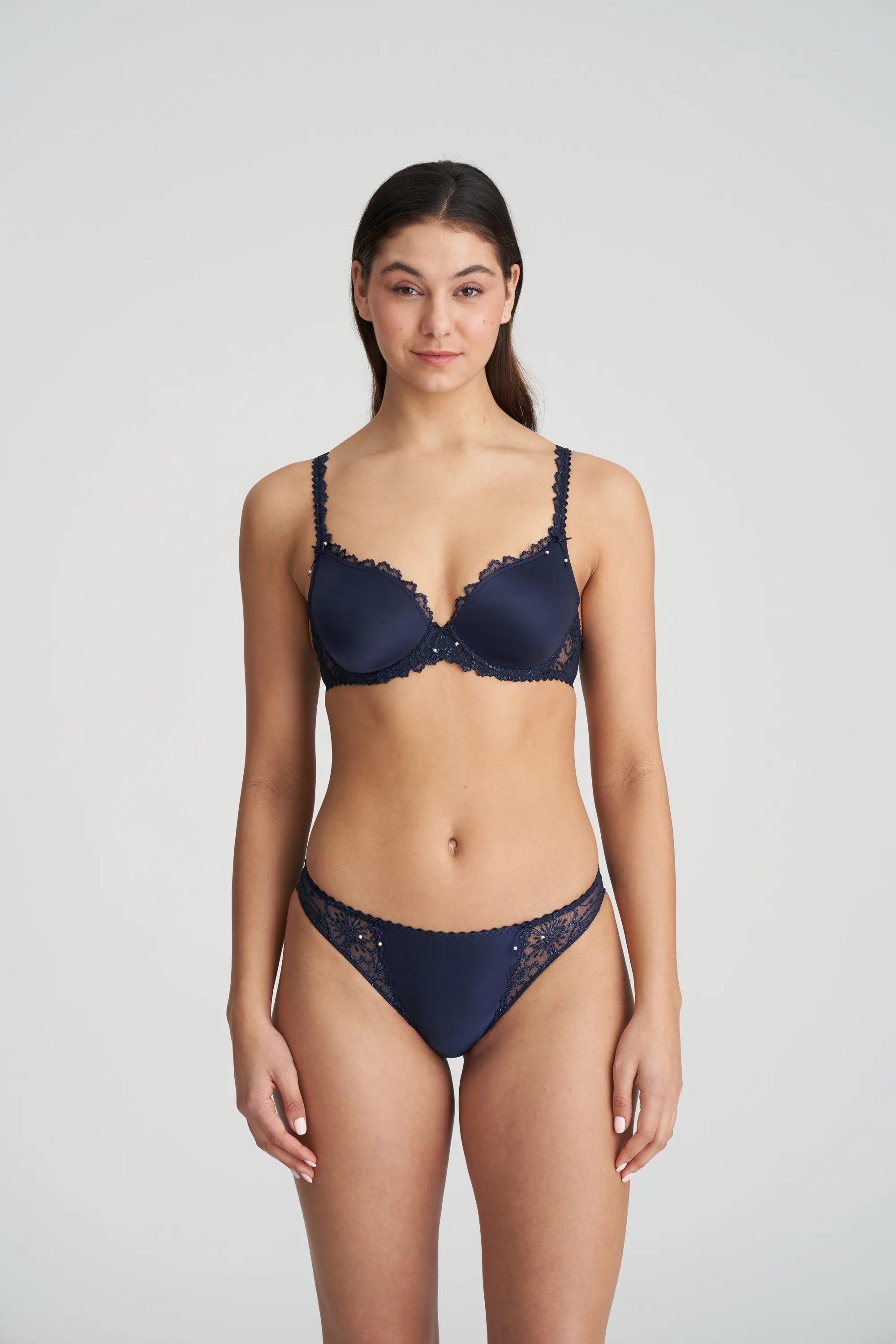 Full body shot of model in Jane Half Padded Balcony Bra Velvet Blue with matching briefs from The Foundation, perfect for a coordinated lingerie set
