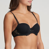 Side angle of Model wearing the Jane Padded Balcony Bra in Black, showcasing underwire support and elegant lace detailing below the bust.