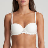 Front-facing image of the model wearing the natural-toned Jane Bra, highlighting neckline and support structure.