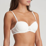 Side angle of Model wearing the Jane Padded Balcony Bra in Natural, showing lace detailing beneath the bust and smooth contour cups.