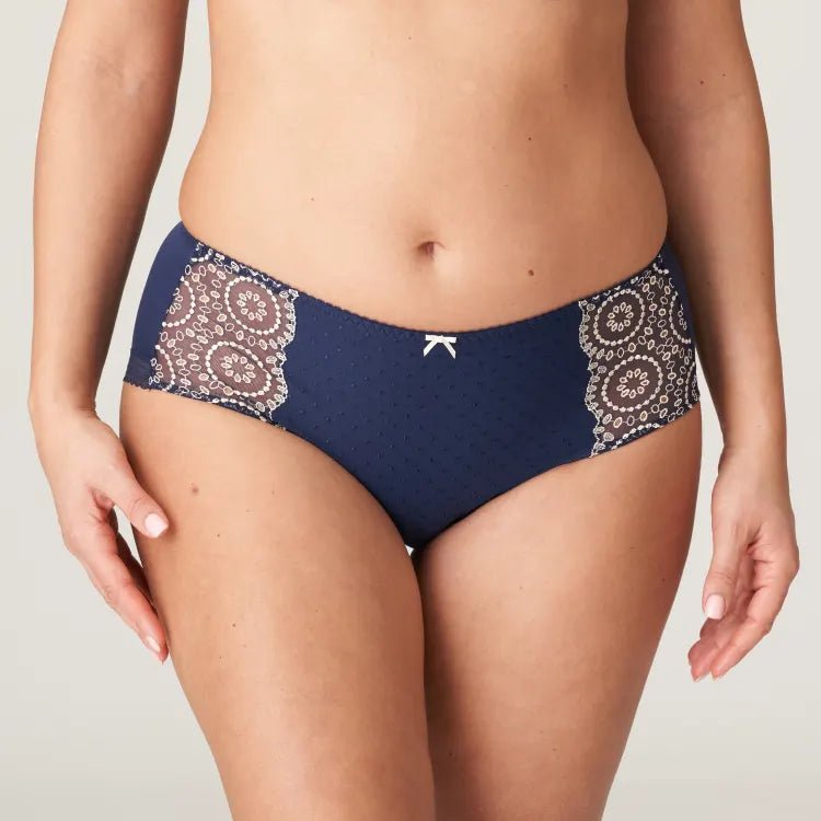 Front view of Osino Full Brief Sapphire Blue, featuring high waist and eyelet lace panels at the sides