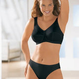 Model smiling in Anita Jana Support Bra Schwarz Black, showing wirefree cotton fit and soft stretch comfort, featured at The Foundation.