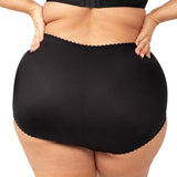 Back view of the Something Else Tum-E-Lace Brief in Black by Triumph, with high-waisted fit and smooth finish—shop now at The Foundation.
