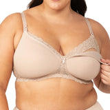 Model wearing Gorgeous Mama Maternity Bra in Nude with one cup unclipped to show drop-down nursing feature.