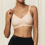 Front view of Triaction Wellness wire-free bra in Neutral Beige, showing soft contoured fit for gentle support.