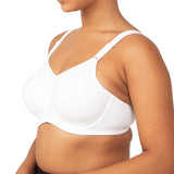 Side profile of a model wearing the Triaction Ultra W Sports Bra White, highlighting underwired support.