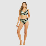 Front view of Model showcasing tummy control swim brief in tropical black and white print with matching bralette top.