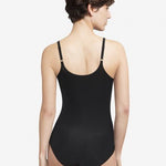 Back view of the Soft Stretch Bodysuit Black on model, from The Foundation, highlighting adjustable straps and seamless design for everyday comfort.