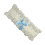 White lace bridal garter with light blue bow, available at The Foundation, elegant Italian-made accessory for a wedding day tradition.