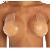 Model wearing Lift Ups for invisible breast lift and support under strapless clothing.