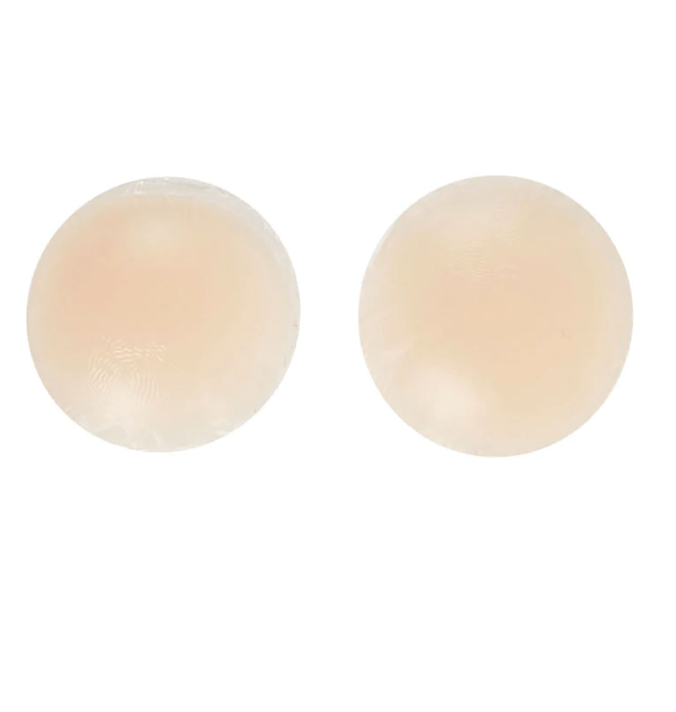 Pair of round nude silicone nipple covers with seamless edge for invisible coverage.