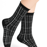 Model wearing Wool Blend Check Socks Mid Black by Bleuforêt, available at The Foundation, featuring black Prince of Wales check merino wool blend socks for women.