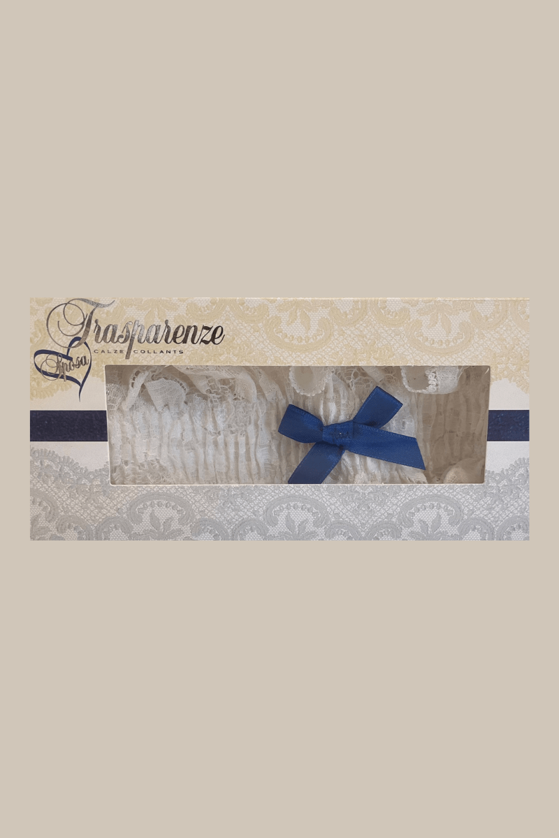 The Foundation’s ivory lace bridal garter by Trasparenze, featuring a delicate dark blue bow, boxed and ready for your wedding day.