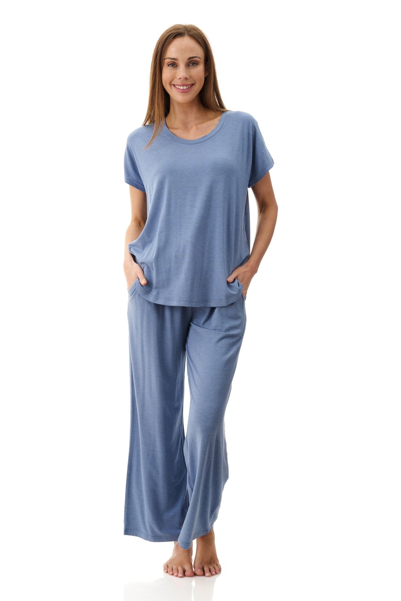 Woman wearing Le Marle Modal Long Lounge Set in Dusk Blue, featuring a relaxed short-sleeve top and wide-leg pants