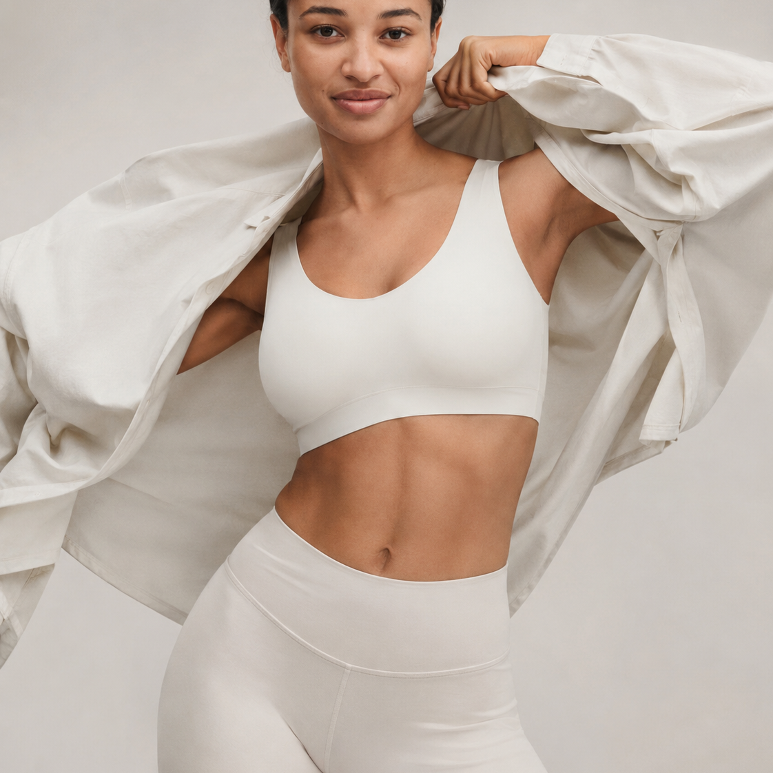 Woman wearing ivory SoftStretch top with relaxed layered styling
