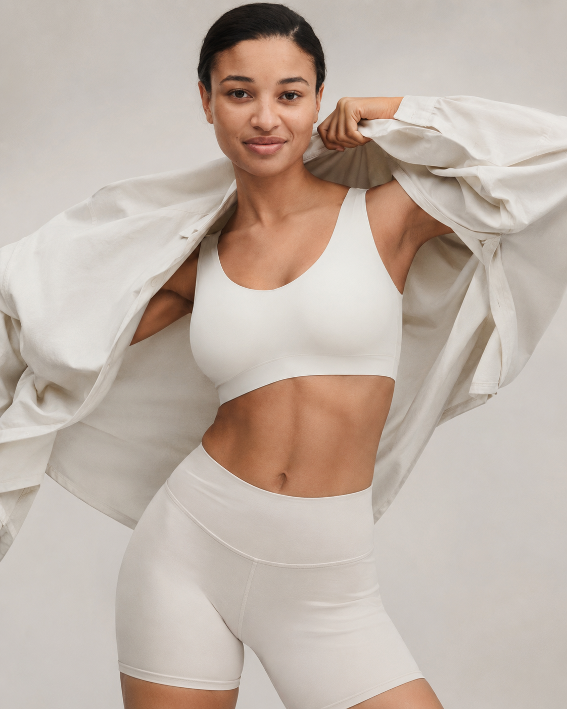 Woman wearing ivory SoftStretch top with relaxed layered styling