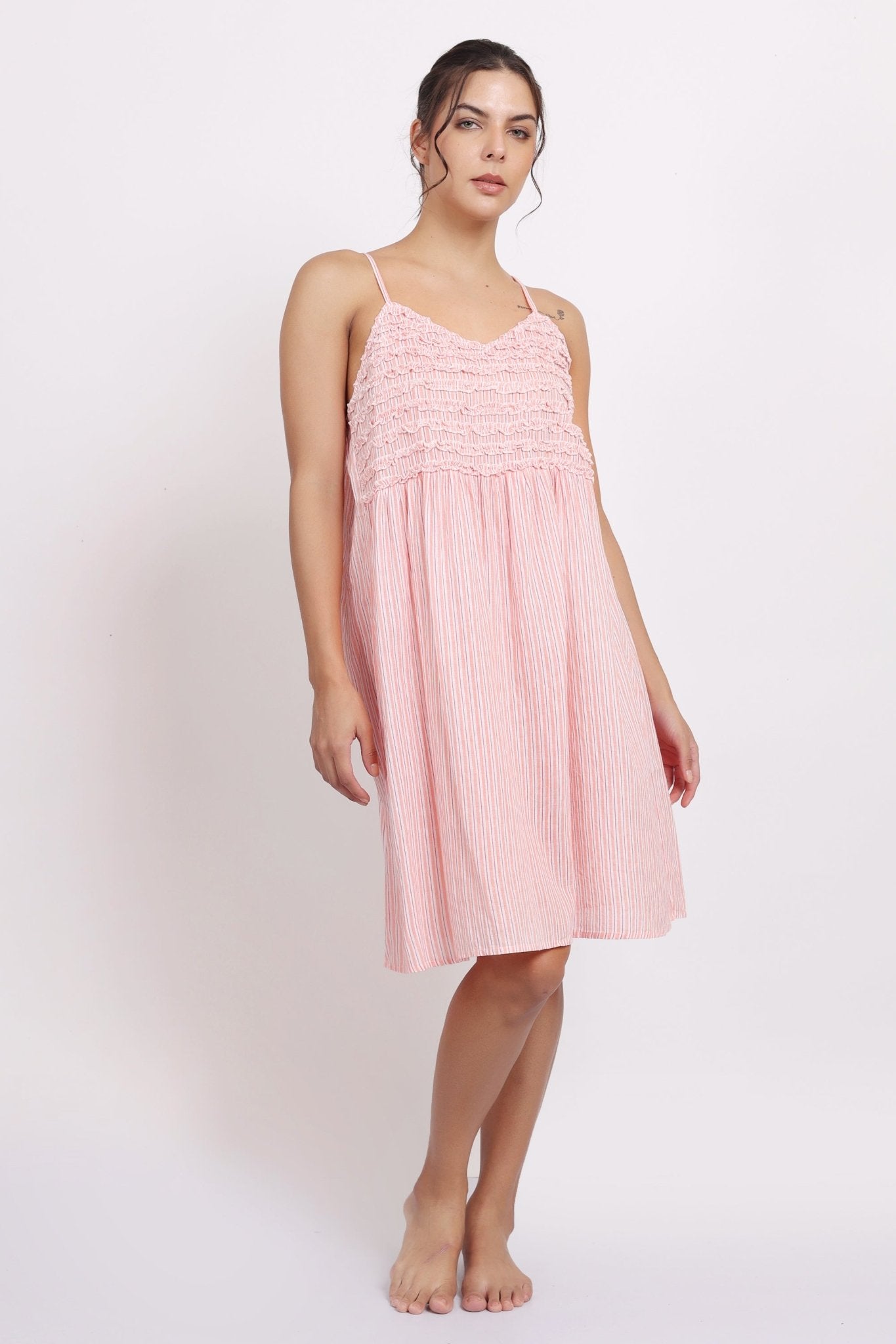 Model wearing Passionflower Frilly Nightie in coral stripe, featuring a square neckline, frill trim, and breezy cotton fit.