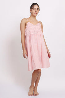 Model wearing Passionflower Frilly Nightie in coral stripe, featuring a square neckline, frill trim, and breezy cotton fit.